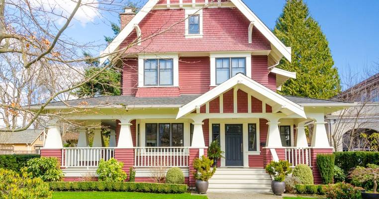 Craftsman house with clean siding and white trim